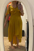 Dress is a true wrap dress so if you're in between sizes, I would choose the smaller size since the waist is adjustable. Material feels quality and I love the color! I've read a couple other reviews that say the snap that keeps the top closed will pop open easily, I haven't worn it out yet but I could definitely see that happening. I'll be replacing it with a looped button closure! - Kaley M.