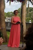 I wore this to a wedding in July and it was perfect. The length was again too long for me and I didn't have time to hem or pin up so I wound up lifting it as I walked all night. Make sure you leave time to fix that  if your shorter. It's an open back with nothing to hide a strapless bra so you'll have to wear stick one if needed, which I did. The open back left plenty of room so I wasn't squeezed in though. Great dress for events! - Crystal D.