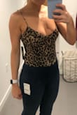 The body suit fits great and is super sexy. I love the open back. Would definitely recommend! - Wendy S.