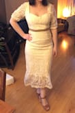 I really wanted to love this dress! I ordered both an XS and a S, and could not even get the XS over my bottom but the S fit perfectly. The top layer of embroidered fabric is beautiful, and the lining is thick and forgiving. My issue was along the neckline. There was too much fabric along the armpits, which added weird bulk. The cut of the neckline left me feeling 'exposed', as it was both wide and low. In the photos I am not wearing a bra because with a bra it felt too busty. Overall the dress was very flattering and well made, and as a petite lady the length was wonderful! Unfortunately the neckline just wasn't quite right. - Jamie E.