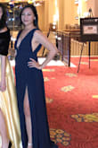 I loved this dress! I wasn't worried about busting out because I don't have a lot.  The fabric was beautiful, the slit was great. All around, loved it. A little fabric tape held things in place but I probably would've been fine without it too. Wish I would've had time to get it hemmed, It was way long even with 3.5 inch heels. - Maria G.