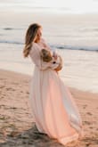 I purchased this dress for a family photo shoot and it was beautiful! I had to order a Medium as Small was out of stock and I needed it soon so it was a little looser than I would have liked. I would have also liked to have it gemmed a few inches but didn't have time to do that as it arrived two days prior to the photo shoot. Nevertheless, the photos turned out beautiful and I received many compliments on the dress despite it being slightly larger than what I would have liked. A friend of mine loved how the photos turned out so much she bought herself the same dress in the emerald color. - Chanel G.