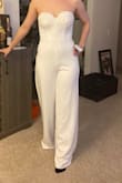 I really liked this jumpsuit and wanted to use it for my wedding rehearsal dinner. Unfortunately the cups were too large for me. I would've spent money to have it altered but since the alterations would include cups and a hem, I didn't think it was worth it. Other than the cups it fit well and material was thick and didn't feel cheap at all. If you can fill it out I would definitely recommend this. - Rae A.
