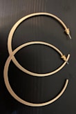 Bigger hoops than I would normally get but the gold color is perfect and subtle. They go with everything! - Emily B.