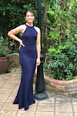 The dress fit so nicely on my daughter. We did have to get it hemmed. She is 5'3 and it was long on her. Everything about the dress she absolutely loved it. - Crystal A.