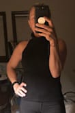 I love this top!!! It is super comfortable, Not see thru at all since it is double lined, perfect length. It is stretchy but not super tight which makes it very comfortable to wear it!! The picture does not do its justice since it is a little dark. - Angelina S.