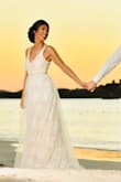 The dress was absolutely perfect for a beach setting. It's light, flows nicely and photographs beautifully. Was able to easily travel with it and only needed light steaming at the bottom upon arrival. It's very comfortable with a little stretch through the bust. - Ashley C.