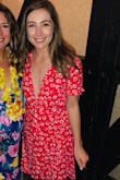 Serious mini-dress. Was nervous about the deep v, but two strips of double sided tape and its all good. Recommend, but beware, super short. It also ties which the picture doesn't show. Long enough to tie in the back or bring around front. - Kyrsten A.