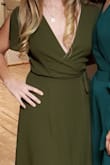 I'm obsessed with this dress and now I want to order it in more colors. I don't have much up top to fill this out, so it does come down a little low. I need a safety pin or tape to feel confident it won't fall open, but I'm able to wear it without a bra, which is always a win. - Danielle G.
