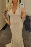 Love this dress! Fit is flattering. Too long for me but that can easily be fixed with alterations. Material is thick but not heavy. The tie on the back is perfect for adjusting how the dress fits at the chest. Love it! - Melissa H.