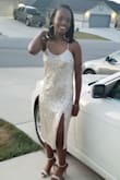 Dress is more gold than silver. Fit is very loose. - Beverly B.