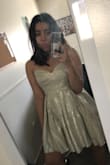 I bought this dress thinking it was going to be more silver than gold, but to my surprise IT WAS GOLD. Don't get me wrong, I love the GOLD look! It was a little tight zipping it up but that's just because i have a broad back. I love this dress :) - Jasmin L.