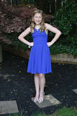 Bought this for my daughters 8th grade formal and loved this on her! She looked amazing and got so many compliments. Wasn't too revealing at all (as many girls this age dress....) it was a cute yet classy dress. The back was most flattering part, she is about 90 lbs soaking wet and we bought her the XS- the back straps made it easy to fit her properly- she looked amazing! - Nicole P.