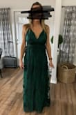 You cant wear a bra with this since the back is open. The top front is very loose and almost lifts out on the edges. Otherwise fits great. Perfect length and waist. I would say NOT for a chesty girl! Wearing it for a bridesmaids dress so I will keep and alter! - Alyson C.