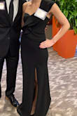 I love this dress! I have no curves and it's hard for me to find dresses that fit! I bought an extra small and it fit perfectly. The material has some stretch to make it fit well and be comfortable! It was a little long even with heels so I hemmed the bottom. - Corinne P.