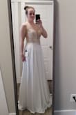 I was so worried ordering a wedding dress online without trying it on first, but WOW!! I am so happy!! I was in tears when I put it on. It fits like a glove and is sooooo beautiful!! The beading is so pretty and the quality of the material is just amazing!!! - Kelsey M.