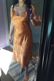 I wanted to love this slip dress but it just didn't make the cut. The fabric and color are beautiful but the fit is weird. It's a bit loose on top and tight in the middle, and it bunches up in the back. It also looks like a nightgown. Not for me. - Melina C.