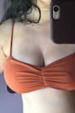 I tried this top in XL and it fits loose, the fabric is thin and not supportive for a 36DD. I ordered one in L but hasn't arrived yet. The color is not as dark rust as in the picture, it's a lighter dirty brown. I don't have high hopes for the size large, as the fabric is so thin I doubt is going to work for me. This is going back. - Melina C.