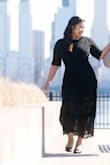 I used this for my engagement photoshoot and it was comfortable and flows well while showing my shape. Sizing follows the size chart so I would go based on that if you're in between sizes. - Diane P.