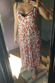 I wanted to love this dress so badly. The fabric is so soft and the color is beautiful. Unfortunately the top part is not designed for bigger busted women. The cleavage is way too low to be worn with a bra, but I can not not wear a bra, it just doesn't work. I tried both L and XL. Fist photo is the L, fits better on the lower part but way too small on top. Second photo is the XL, which is too big on the underarm area but still too small for my big bust on the front. This seems to be a issue with most of the dresses I've tried from Lulus, they just don't design clothes right for big busted ladies (with the exceptions of some wrap dresses). Hope they realize our big tatas need more room! - Melina C.
