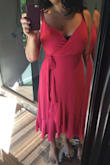 Of all the Lulus dresses I've tried this one and another wrap dress style are the only ones that accommodate my 36DD babes...sort of. It's still a bit revealing but that can easily be fixed with a pin on the front. The dress fits very nice and the fabric is soft and flowy so it hides all my bottom imperfections. Wish it came in different colors and patterns, as i haven't had much luck with any of their other styles, would like more options on this style in different colors. I tried the blue and yellow and didn't love them so much. This one is not as orange as it look in the picture, is more like a dark fuchsia, wish it was more rust like the photo. The length is nice as it can be more casual or formal depending on the accessories. - Melina C.