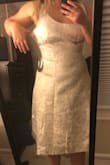 I ordered this dress to wear at my bridal shower. The material felt nice, but there were some loose threads at the bottom when I opened the package. The top was way too loose, but the waist fit snug. I chatted with a fit expert before ordering so I'm disappointed that the fit was so off. - Erica C.