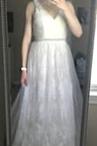 I initially purchased another Lulus dress for my wedding, I really liked it... but then I saw this dress. Bought it on a whim 'just to see'. A friend came over to help me zip into it. When I turned around, I felt like my heart exploded and I immediately burst into tears. Perfect isn't an adequate enough adjective. The lace detail is beautiful; subtle but unique enough to make an impact. The little beaded belt around the waist is just enough bling to make me happy. I did order a size up because I was concerned the fabric wouldn't have much stretch. I will definitely need to have it taken in around the bust and the waist, and the length taken up. However, I anticipated this prior to purchasing, so this isn't a negative. If you're looking for a comfortable yet beautiful wedding dress, this is it. I'm teary eyes just thinking about wearing it on my wedding day. I wish my mom was still here to see it, because I think she would love it just as much. - Allison K.