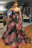 It looks exactly as the photos. The material is very flowy and light. The only thing I didn't like was no padding for the chest so you'd have to wear sticky bra for this because a strapless wont work. Other than that, I love it. I added a hoop skirt underneath to make it more poofy. But it still looks great without. - Boots T.