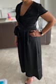 I got this for my cousins wedding. It was a little tight in the midsection, but if I went up a size I think it'd be too loose. Wore a tank top underneath because it was too low cute for my liking. Thought it was really cute though! - Lydia B.