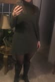 The color of this dress is dark olive- but you can barely pick up the color of it- which is fine. The material is a bit stiff- but still comfortable. I love it - Carrie J.