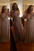 Dress is a great, heavy, quality and material. Needs to be hemmed, and for my personal liking need a few stitches done on cleavage cut, but nothing major. Shipping was super quick, even while doing their standard option. I have more than enough time to go to a tailor. Very happy with the fit, it is loose, but I don't mind it. Bought the dress to be used as my bridesmaid dress for a wedding and I'm so excited to wear it. It's a beautiful color too. - Brittany S.