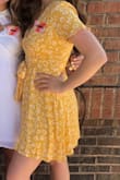 Beautiful dress! I wore it for my sorority recruitment, and was a little nervous about the plunging neckline moving around and leaving me exposed, but it stayed in place all day long! It's my favorite dress I own! - Karinna N.