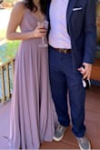 I needed a bridesmaid in a month and a half, so I decided to give Lulus a try! I did the free standard shipping and my dress came in within 5 business days! It is a little bit more purple, which was perfect for the wedding I was in! I was also elated because the size chart was accurate, and I didn't need any dimensions removed. I have an average height of 5'6, and I wore 2" heels. The dress ever so lightly touched the floor. When you walk since it's so flowy, you have to kick out, but it's not too bad. I absolutely loved the way it felt to spin around!  This dress made me feel very beautiful! The material is very durable! The wedding was in the woods, so I wore it on rough terrain. I have another wedding to attend, and I will definitely be getting my dress from Lulus!!! - Emily F.