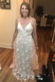 The dress is beautiful, a little lighter than the picture but perfect for my wedding dress - Kimberly W.