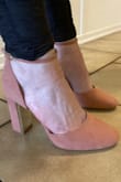 Thin, slippery soles and stiff, awkwardly-cut material. You're asking for blisters and a sprained ankle, if you actually attempt to wear these shoes. - Olivia R.
