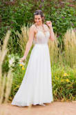 I saw this dress online months before my wedding and I loved it!!! Went to a few stores looking for dresses and nothing was similar to this one! I had it stuck in my mind and I can definitely say that I couldn't go wrong with this dress! I ordered size 8 because it wasn't available often and it was good, but I also ordered the size 6 to make sure which one would fit better! Ended up returning size 6 and staying with size 8. Got tons of compliments on my wedding day! I got married on a boat and it was the perfect dress for the type of wedding. Again, ended up staying with dress size 8. If you are not sure, just do like I did: order both and return the one that doesn't fit. - Emilia D.