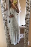 I ordered this dress along with a few others and honestly thought this would be my least favorite I even regretted ordering it. But once I tried it on it is so flattering! The shape is beautiful the beading is very nice my mother in law couldn't believe the price for how gorgeous this dress looks it looks like a legit gown. It's the one I'll be wearing for my wedding! I paired it with a tulle veil from amazon and absolutely love it! - Anjelica S.