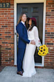 I bought this dress at the last minute to wear for my wedding. I bought small and medium and found that the small was a little too tight around the shoulders. I was worried about the depth and openness of the top, but I wore a sticky bra type thing and it worked out fine! - Rebecca H.