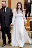 I loved the overall texture of the dress and shape! The zipper was a little tough and the back just was a tad bit tight. However I would order this size again. It was a beautiful dress for my small intimate wedding. So happy with my dress. Loved it. Wouldn't have had a different dress for the day. - Arielle N.