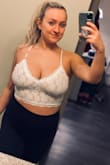 I was super nervous to order this top because so many reviews talked how tight the band is around the top.. but i am SO GLAD I ORDERED IT! There was only a large left and i knew i needed the large because of my cup size. 

This top is cute, comfortable, the band at the bottom is VERY stretchy; I don't know how everyone else said it was too tight. 

If you're not sure if youre going to buy this, I'll just say this, DO IT! - Lanna D.