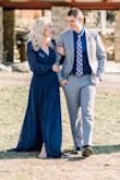 I wore this for our engagement photo session. It was absolutely stunning. I received so many compliments on it. The dress was a little long for me, I was able to camouflage it with positioning and heels. And the plunge was a little too deep for my preference so I popped a pin in there. Just two factors to consider! I absolutely loved it! - Kaitlin C.