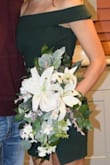 I wore this dress at my homecoming. Though I had to get the bottom altered a few inches, I really loved this dress. I was worried that maybe it'd be hard to dance in but I didn't have a problem at all and rarely had to pull anything up. The green is stunning in person!! - Teanna C.