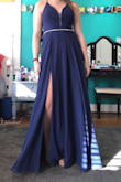 I bought this dress for my senior prom and I am in love. The color is so pretty and the slit makes it very flowy and pretty. I love how I don't have to worry about a bra because it already has padding in the dress. The dress is a little long but works fine with heels. The back is a little hard to tie and I can't do it alone so I suggest you get this dress if you can get someone to help you tie the back. - Jacqui H.
