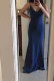 The fabric is thick and soft, feels very nice and comfortable. I was worried that the length would be too long, but with heels it is perfect! However, I do have to alter the straps because for it to fit on me the strap adjustment thing shows and it isn't a good look. - Vivien P.