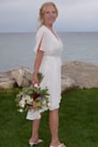 This is a perfect casual wedding dress! You don't have to worry about it being too tight or too loose because it's a wrap dress. I received many compliments on it. The material is great. It's nice and flowy. I actually had it hemmed by my choice because I wanted a high-low look at the bottom. I may order another color. I absolutely love this dress! - Donna F.