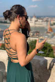 I wore this dress to a wedding in July. It was super comfortable and I got tons of compliments! I did need some help getting it strapped on but well worth it! - Cristina P.