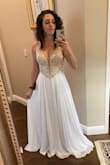 This dress fits me like a glove and it easily looks more expensive than it actually is. Beautiful bead work and the lace-up back is so romantic. Contemplating adding a petticoat underneath to add a little more volume but honestly, it's beautiful as-is. - Netalia S.