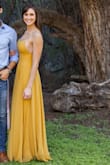 This dress was better than I imaged. The color is vibrant and the fabric is a great quality. The slit is high and sexy, but can be easily hidden. I'm 5'9 and ordered the medium. The dress is LONG. I wore heels and it still hit the ground. - Paige B.