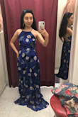 This dress is so elegant and vibrant in person! Can't wait to wear it to an upcoming wedding in Hawaii. I appreciate how easy it is to adjust the top of the dress by tightening or loosening the straps. I'm extra petite, so I expected to get the dress hemmed, though I was a little surprised hemming cost more than the dress itself due to the layers and large amount of fabric the tailor had to take off. This photograph shows the dress before hemming. - Marissa H.