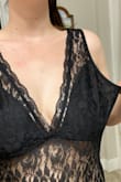 Get the size you normally get... I normally wear a medium and I got a large because of the reviews saying it's tight but don't do that! Large was way too big! Body suits are supposed to be fitted... this was loose and had no boob support at all. - Marissa B.